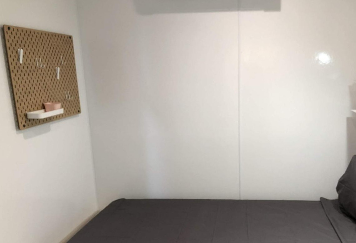 Interior of a Connect Shelter 3 bedroom with built-in bed, storage, and warm finishes.
